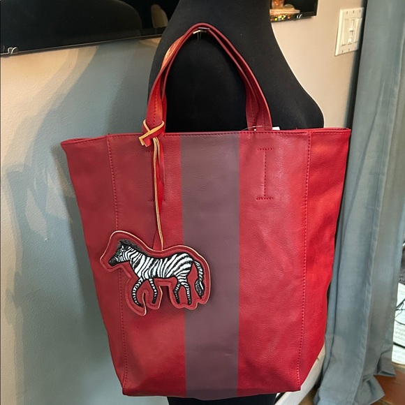 Saks Fifth Avenue Handbags - Saks Fifth Avenue Red and Burgundy Tote with Zebra Charm